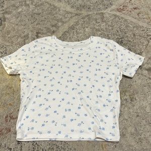Super cute crop top for all. Little sky blue flowers! Gently used.